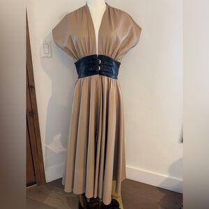 Alexis brand faux leather v neck button down dress with black leather belt.